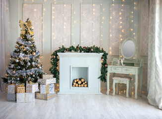 The interior of the Christmas room, a white sofa with pillows at the coffee table and a blue chair.