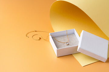 White jewelry box on yellow studio background