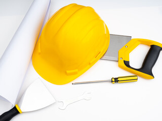 Construction yellow helmet and hand tools. Construction renovation work concept, background for advertising.