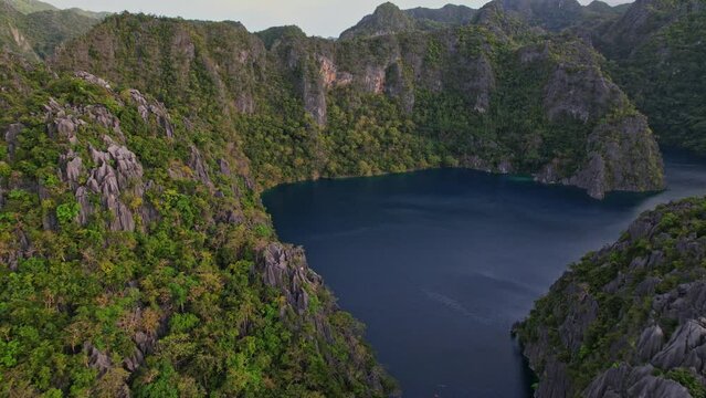 Drone Footage at Baracuda Lake in Philippines. Zoom out and rotation to see the entrance and the costline of the lake and around.