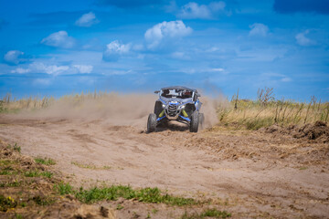 Naklejka premium UTV in action offroad vehicle racing on sand dune. Extreme, adrenalin. 4x4.