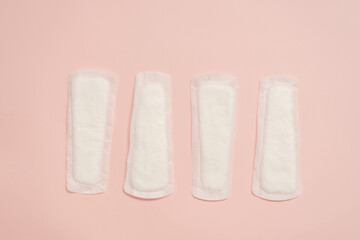 Feminine sanitary napkins (sanitary pads) on pink background