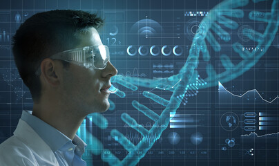 Side view of young genetic lab researcher wearing protective glasses looking an  immersive interface with medical data and infographics. Real studio shot. - 653141435