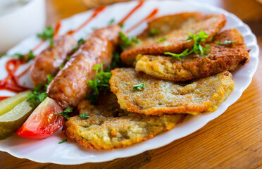 Belarusian pancakes with sausages in a restaurant