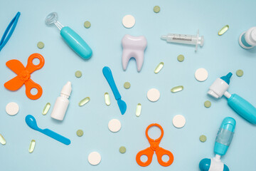 Various healthcare and medical accessories on blue background. Flat lay