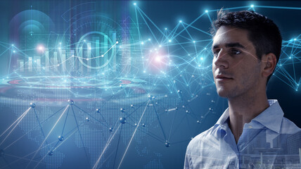 Portrait of a young businessman analyzing stock market graph on an immersive holographic interface. Concept of high technology business and finance. Real studio shot.