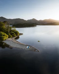 kayaker and tent camping adventure on derwentwater lake, lake district, uk © Joe