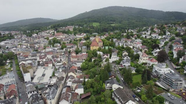 Aerial approaching Markgraf-Ludwig-Gymnasium, a striking cityscape formative yellow school building in Baden-Baden, Germany