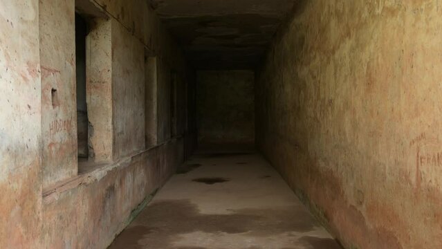 Prison and chamber of torture of dictator Idi Amin in Uganda, Africa. First-person walking backward