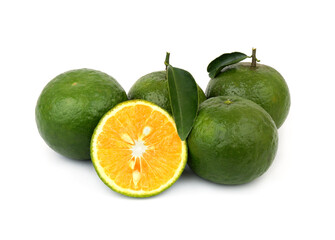 Sliced and whole green oranges isolated on white background