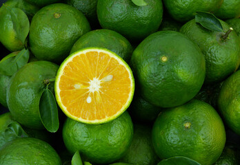 Fresh green oranges close up