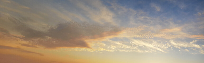 Naklejka na ściany i meble Panoramic pastel color sunset sky background. Sky with cloud, beautiful heaven skyline