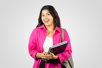 Young and Beautiful Asian Nepalese Student Abroad Study Giving gestures with notebook in hand