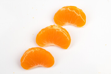 Isolated citrus segments. Collection of tangerine, orange and other citrus fruits peeled segments...