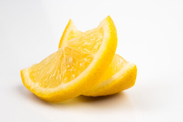 Slices of lemon citrus fruit isolated on white background. Lemon slice with shadow.
