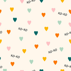Funny multicolored hearts seamless pattern. Random cute pattern in retro style. Simple vector hearts and hand lettering xo xo. Creative design for fabric, notebook, gift wrapping.