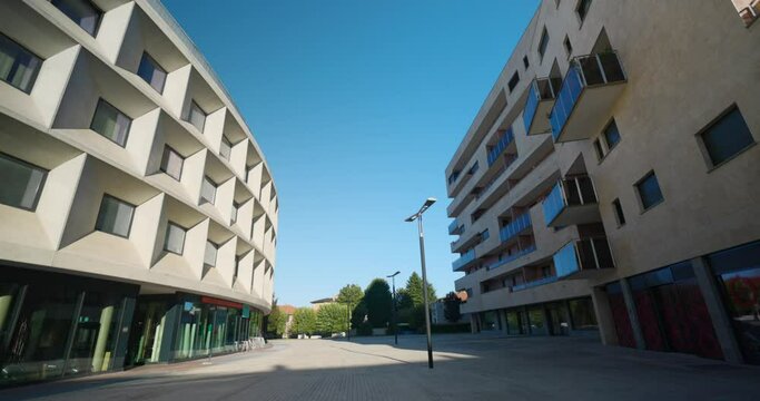 Residential buildings in Vimercate, establishing tilt down shot, empty street
