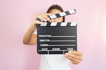 hand holding movie clapper clapboard film action concept director scene action cinema movie making...