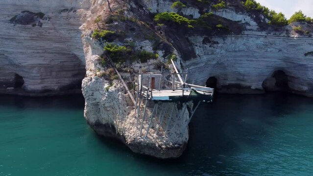 Trabucco Fisherman house on cliffs surrounded by sea