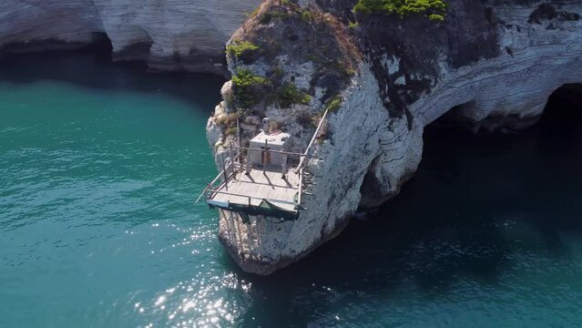 Trabucco lonely fisher hut at mediteran cliffs in italy