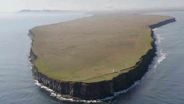 Aerial shot of beautiful green flat peninsula named Langanes during summer day on Iceland Island