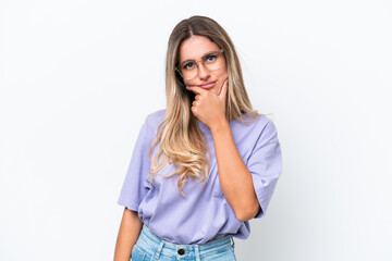 Young Uruguayan woman isolated on white background having doubts