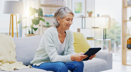 Relax, tablet and senior woman on sofa in living room scroll on social media, mobile app or the...