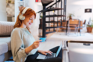 Technology people online shopping concept. Happy smiling woman with laptop computer and credit card