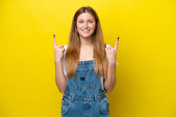 Young caucasian woman isolated on yellow background pointing up a great idea