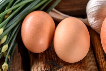 Top View Close-up of Fresh Brown Eggs on Wooden Table - 4K Image