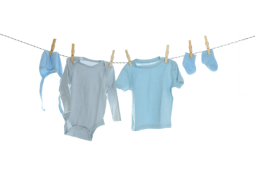 PNG line drying baby clothes isolated on white background.