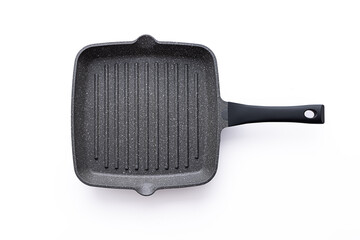 Modern stone and aluminium pan for frying and cooking of vegetable, fish and meat steak, stainless steel frying pan isolated