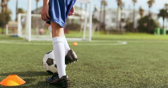 Youth, kid, and alone for soccer with training, goal or practice for competition with back view. Boy, person or player with dedication for mindset, motivation and exercise on field to win in game