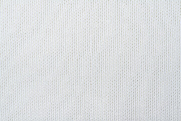 Sweater or scarf fabric texture large knitting. Knitted jersey background with a relief pattern. Wool hand- machine, handmade. - obrazy, fototapety, plakaty