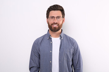 Portrait of handsome man in glasses on white background