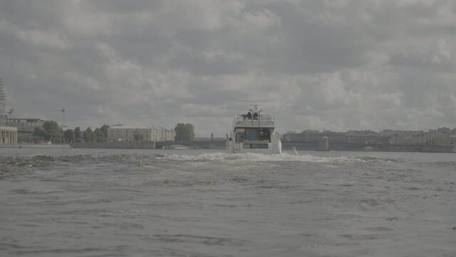  A luxury white yacht sails on the Neva River in St. Petersburg. Rich people have fun on a luxury yacht. S-log3