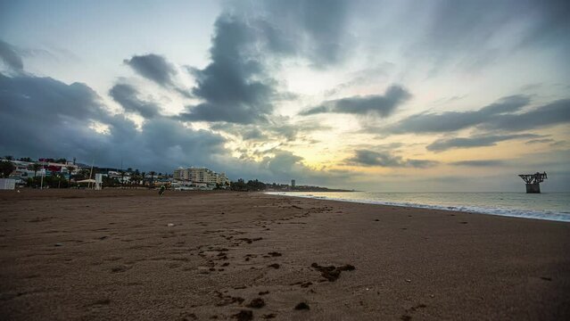 Sunset Beach Timelapse of Playa de Torrox, Spain. Sky from Blue to Yellow.