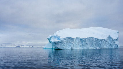 Big Iceberg in Calm Water - 653188473