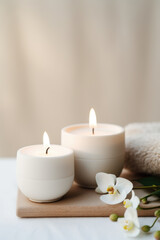 Luxury lighting aromatic scented glass candle display on the grey table in the white bedroom