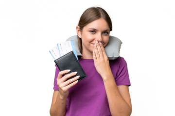 Young beautiful blonde woman with Inflatable travel Pillow over isolated background happy and smiling covering mouth with hand