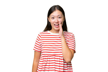 Young Asian woman over isolated background thinking an idea