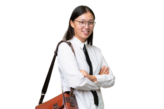 Young Asian business woman over isolated background with arms crossed and looking forward - Powered by Adobe