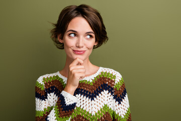 Photo portrait of lovely young lady touch chin think look empty space wear trendy print knitwear...