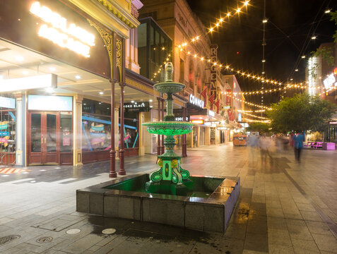 View of Regent Arcade with fountain and assorted shops in Rundle Mall on December 3, 2023 in Adelaide, Australia