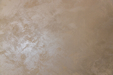 golden texture background. The texture of golden decorative plaster or concrete. Abstract grunge...
