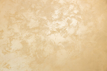 golden texture background. The texture of golden decorative plaster or concrete. Abstract grunge...