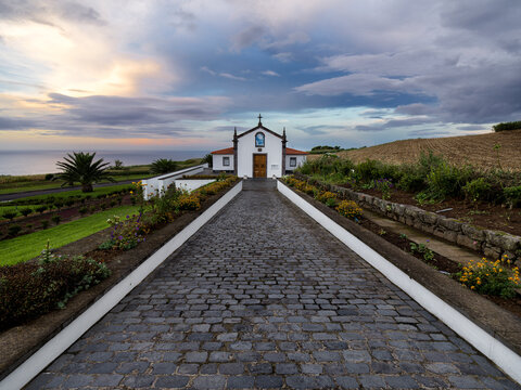 Cloudy sky at sunset over Ermida de Nossa Senhora do Pranto little church in the north of Sao Miguel Island, Azores Islands, Portugal, Atlantic