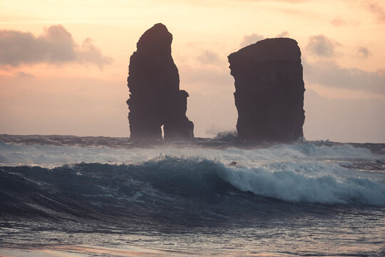 The sea stacks of Mosteiros at sunset with high waves in the foreground, Sao Miguel Island, Azores Islands, Portugal, Atlantic