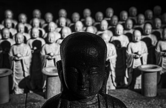 Hundreds of jizo statues lined up at the Hasedera Temple, Kamakura, Honshu, Japan