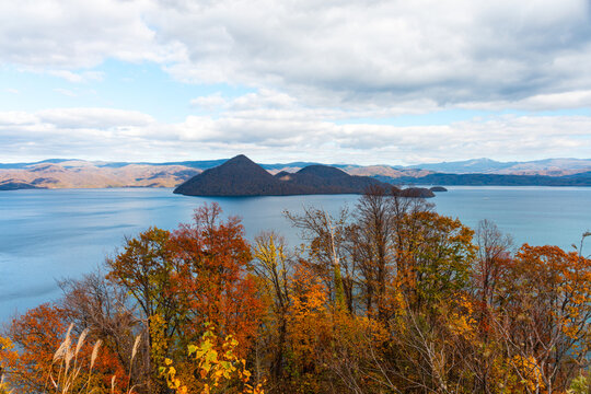 View from above onto Lake Toya and the island inside the crater, in autumn, Abuta, Hokkaido, Japan